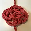 Chinese button knot Doubled ABOK #601 flat, with one end from outside all the way