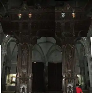 Armorial and ornate support for the organ in the Church of Saint-Léon-IX.