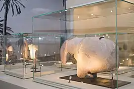 A large ancient stone carving, dating back to 8100 BC, of an equidae - an animal belonging to the horse family, found at Al-Magar. The piece itself, measuring 86 cms long by 18 cms thick and weighing more than 135kg., is a large sculptural fragment that appears to show the head, muzzle, shoulder and withers of a horse.