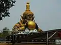 Rahu eclipsing the moon statue in Thailand