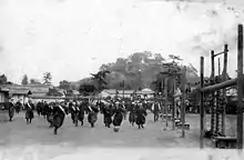 Image 12Japanese high-school girls playing football in their traditional hakama with one team wearing sashes (c. 1920) (from Women's association football)