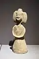 Earthenware Nanjing female figure wearing youren upper garment and a skirt with a straight-necked undergarment; d. Southern dynasty.