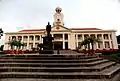 Another view of the Clock Tower, with a statue of Tan Kah Kee in front of it