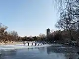 Students skiing over the Weiming Lake before the 2022 Winter Olympics in Beijing