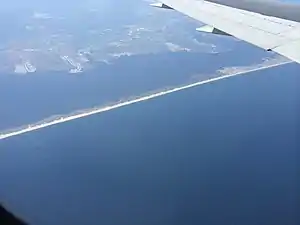 Aerial view of Lavellette on the Barnegat Peninsula, separating the Atlantic Ocean (below) from Barnegat Bay and the mainland of Ocean County (above)