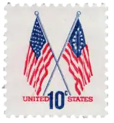10¢ stamp released in 1973, showing a 50-star flag and a Betsy Ross flag together, to commemorate the United States Bicentennial.