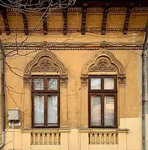 Romanian Revival windows with mascarons at the top, on the facade of Strada Polonă no. 13, Bucharest, Romania, unknown architect, c.1900