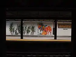 The 163rd Street–Amsterdam Avenue station, with a mural commissioned from Firelei Báez in 2018