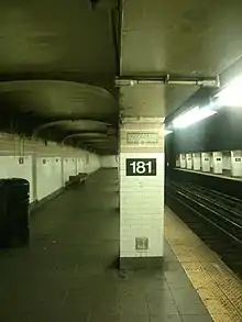 A column with the number "181" and a low ceiling within the platform extensions