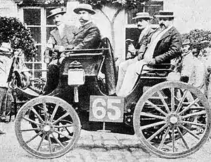 Paris-Rouen 1894. Albert Lemaître (pictured on left) was classified first in his Peugeot 3&nbsp;hp. Bicycle manufacturer Adolphe Clément-Bayard was the front passenger.
