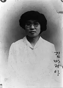 Maria Kim with glasses and a hat
