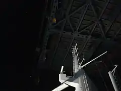 The Queen Mary 2 radar mast passing under the Verrazzano Bridge