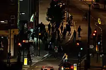 Looters attempting to enter a cycle shop in North London during the 2011 England riots