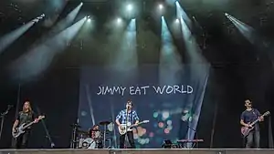 Jimmy Eat World performing in 2018 Left to right: Rick Burch, Zach Lind, Jim Adkins, Tom Linton