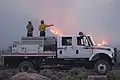 Firefighters overlooking the Mangum Fire on June 24, 2020