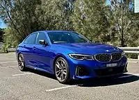 Front 3/4 view of BMW M340i xDrive in Portimao Blue