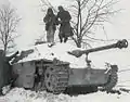 291st engineers disarm a booby-trapped Sturmgeschütz III during the Battle of the Bulge