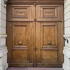 Door in Bucharest, decorated with a pair of swags in its upper parts
