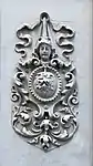 Arabesque with a mascaron and a cartouche, on a façade of an 1890s or 1900s city-house from Bucharest