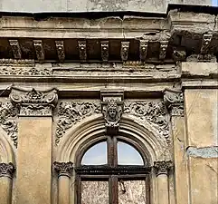 Complex pair of foliate heads above a window of Strada Justiției no. 46, Bucharest, Romania, unknown architect, c.1900