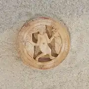 Figure with fish and bird