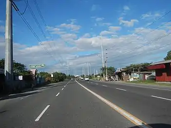 Portal towers located between steel pole 98 and lattice tower 99. Nearby is the Mexico-Hermosa transmission line.