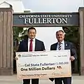 Assemblyman Phillip Chen presents check to Cal State Fullerton.