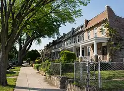 Rowhouses set back uniformly from the street