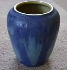 Rear of the Arbo vase in the "Moon & Moss" style with carved oak trees.