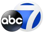 The ABC network logo, a black disk with lowercase letters "abc", overlapping a blue disk trimmed in white featuring a stylized white numeral 7.