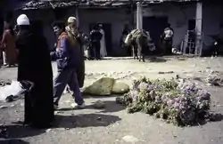 A market with useful plants. Bundles of plants with pink flowers, May 1997