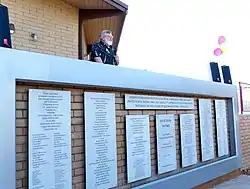 Dr. David Young, Campus Director, presenting the Dedication Wall in 2012
