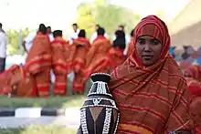 Image 54A Somali woman showing a decorated pottery (from Culture of Somalia)