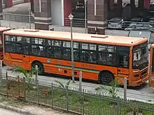 A bus of the "Yamuna Sarthi Bus Seva" at the Botanical Garden metro station