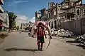 Image 5A man carries a huge hammerhead shark through the streets of Mogadishu