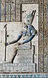 A relief in Hathor Temple at Dendera shows Horus of Edfu, sitting on a throne and wearing the combined crowns of Upper and Lower Egypt