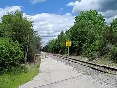 View of the access road for the MBTA layover yard at East Junction; this section of track is currently disused