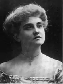 A young white woman with light coiffed hair