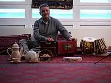Image 12Elements of Afghan culture including: tabla and harmonium musical instruments, an Afghan carpet, teapot, and sheer pira dessert (from Culture of Afghanistan)