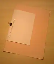 Used to attach a piece of paper to an envelope