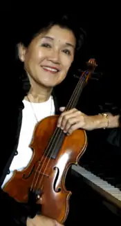 Agus with her two instruments