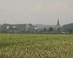 Brewery of Alken (left) and St-Aldegondis Church (right)