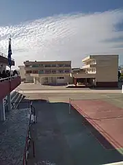 Altocumulus cloud in a high school in Argos, sunlight clearly visible