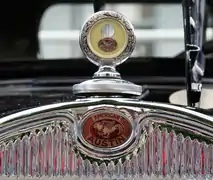 An American Austin hood ornament