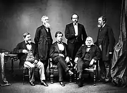 Studio black and white portrait of American High Commissioners. Sec. Hamilton Fish seated in center.
