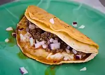 Quesabirria with onions and cilantro