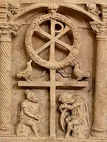 The Chi-Rho with a wreath symbolizing the victory of the Resurrection, above Roman soldiers, circa 350.
