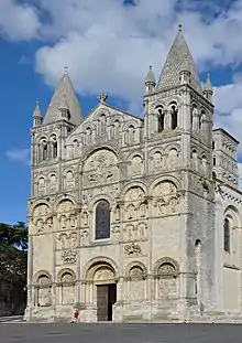 The facade of Angoulême Cathedral was built between 1110 and 1128 in the Romanesque style