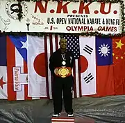 Anthony Arnett at the 1st place podium in the N.K.K.U. U.S. Open National Karate & Kung Fu Olympia Games