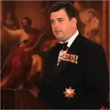 Anthony Bailey (with infrequent orders and medals) speaks at Faith in Sport Olympic Gala Dinner in London, United Kingdom (2012)